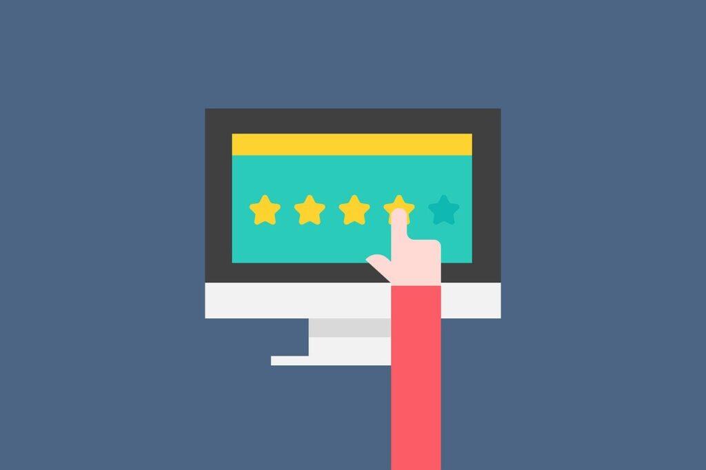 finger pointing to a 4 out of 5 stars rating on a screen