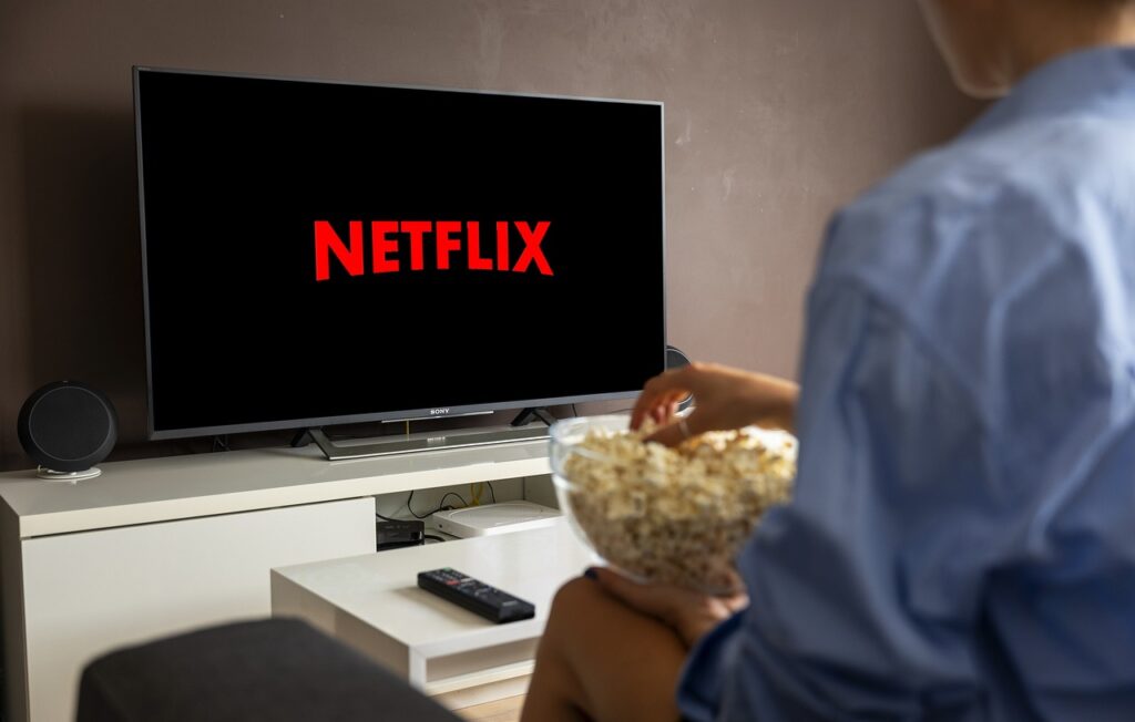 Person eating popcorn about to watch Netflix